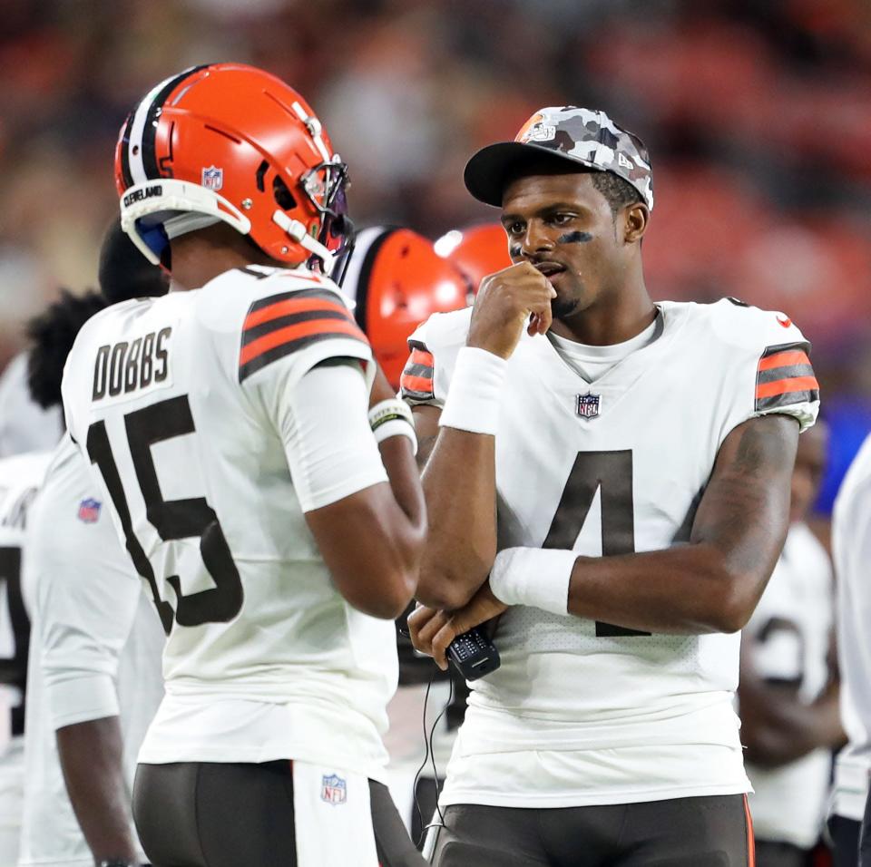 Browns quarterback Deshaun Watson (4) talks with Joshua Dobbs during the first half of a preseason game against the Chicago Bears.