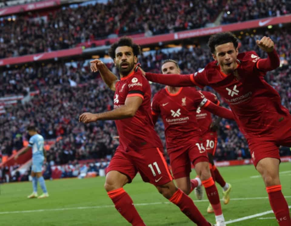 Liverpool players celebrate Mohamed Salah’s wonder goal against Man City