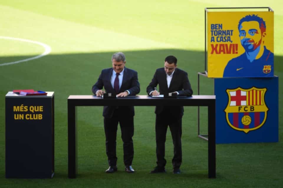 Xavi signed his new contract as Barcelona manager in front of thousands of adoring fans at the Nou Camp